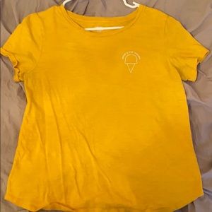 Gold “what’s the scoop” tee